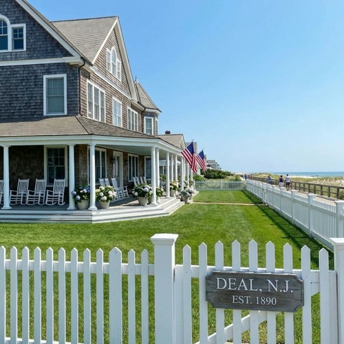 Classic shingled cottage estate in Deal NJ with ocean views and white picket fence